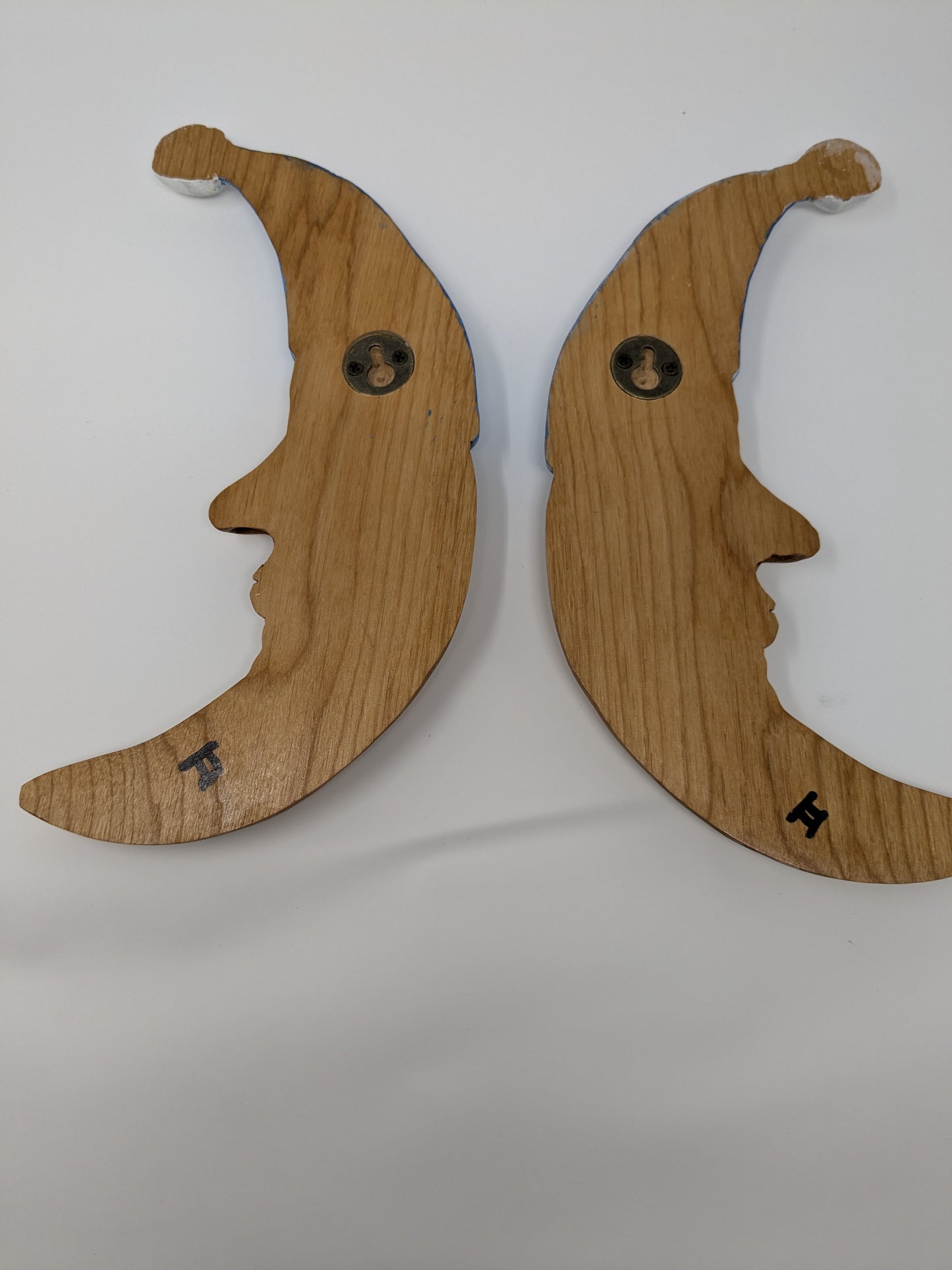 Twin hand carved wooden moons for hanging as wall art in the nursery and kid's rooms